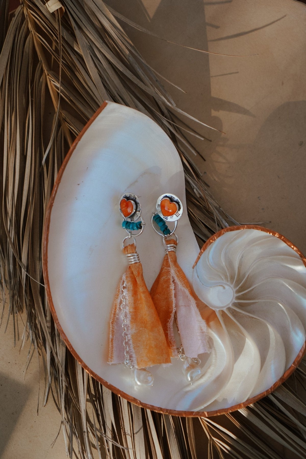 Earrings in Spiny Oyster Hearts and pearl beads