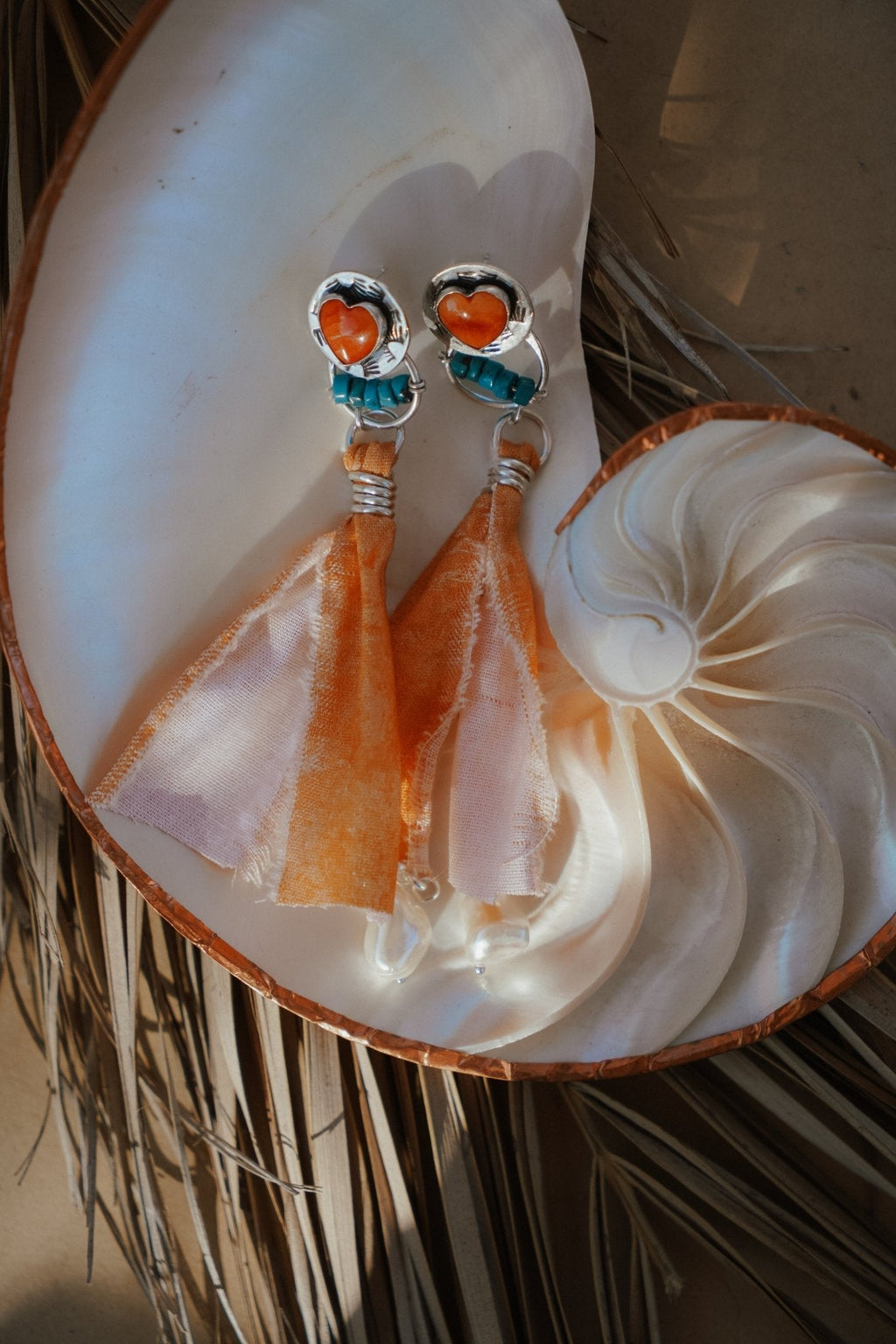Earrings in Spiny Oyster Hearts and pearl beads