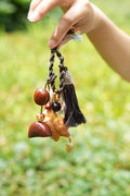 "The Guardian Lion" - Hand-Carved Wood Bag Charm with Tassel & Seed Bell