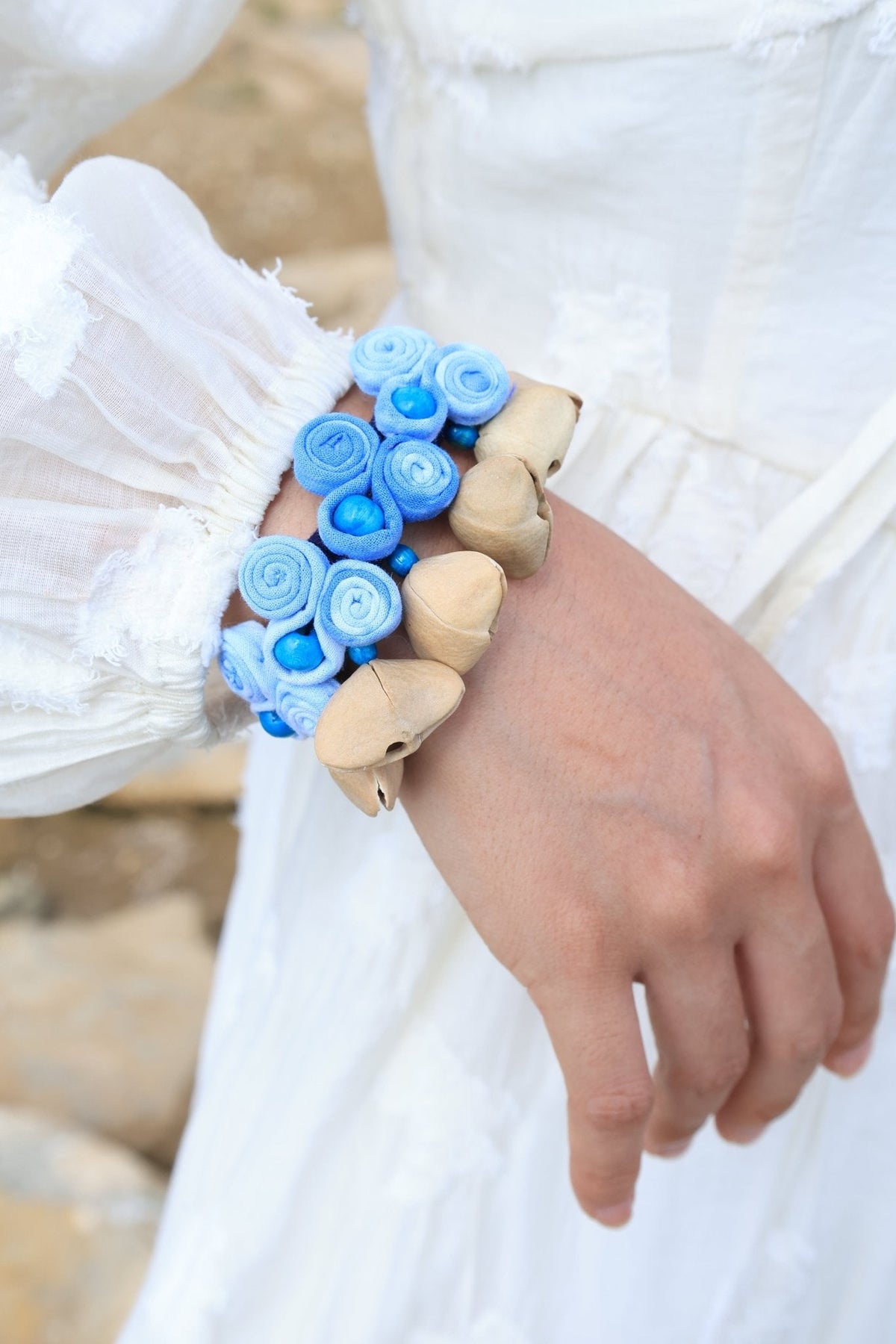 "The Indigo Ripple" - Handcrafted Blue Fabric Rosette Wrist Rattle with Seed Bells