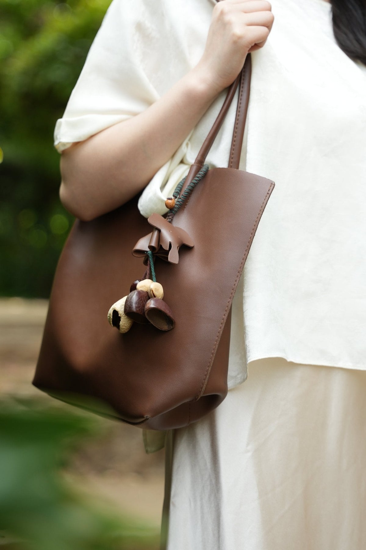 "The Leather Elephant Guardian" - Handcrafted Leather Bag Charm with Natural Seed Bells