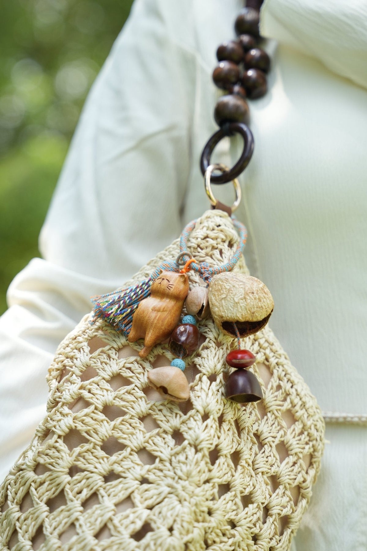 "The Naptime Kitty" - Hand-Carved Wooden Cat Charm with Natural Seeds & Tassel