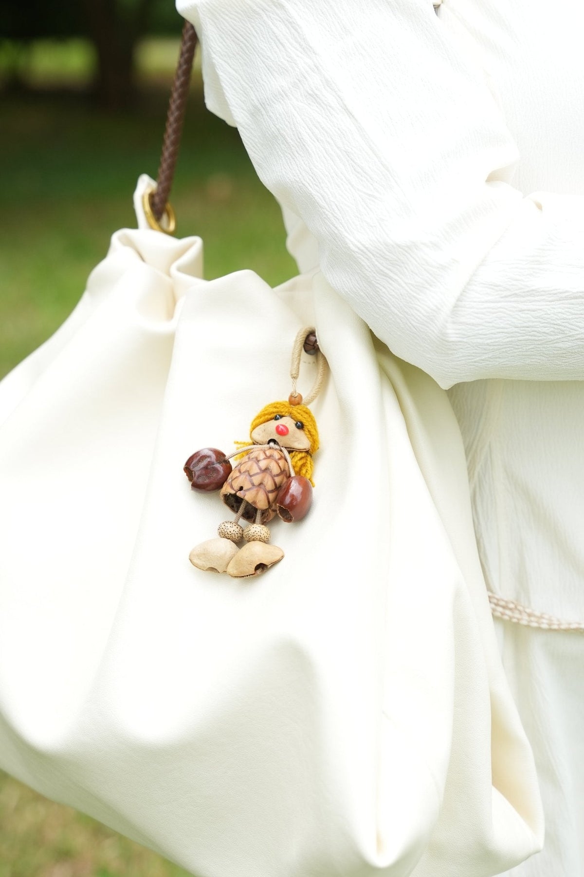 "The Pinecone Pixie" - Handcrafted Nut Shell Doll Bag Charm with Yarn Hair