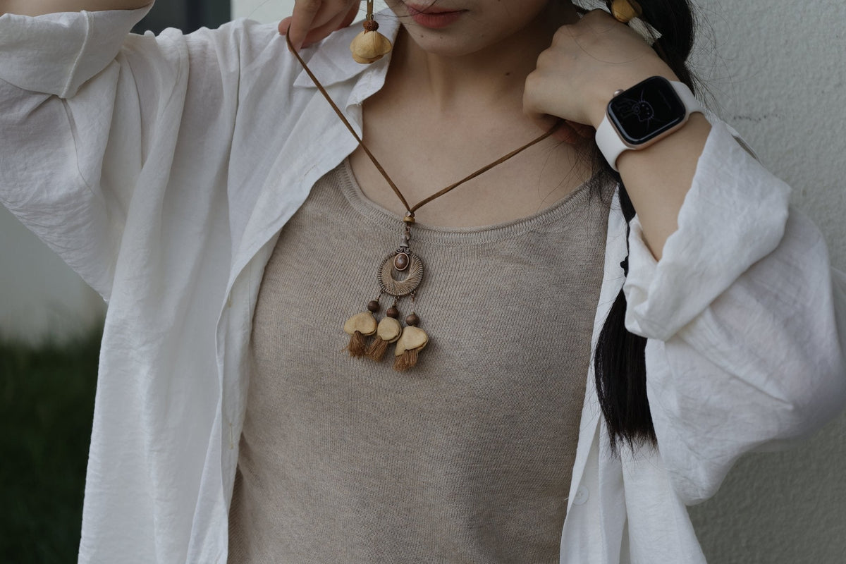 "The Sunset Weaver" - Bronze Woven Mandala Necklace with Natural Seeds & Brown Tassels
