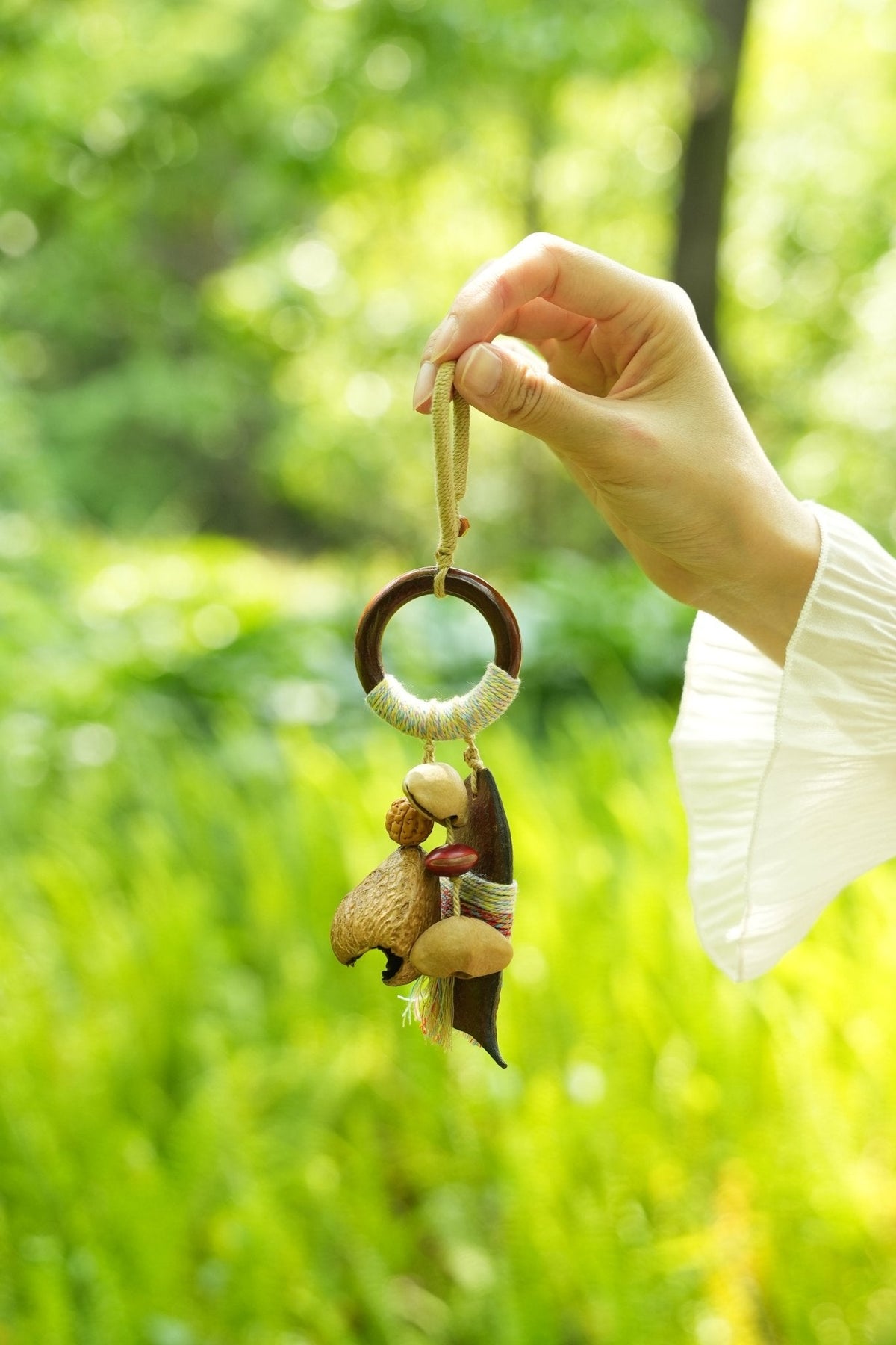 "The Yarn-Wrapped Voyager" - Long Seed Pod Charm with Pastel Thread Art & Wood Ring